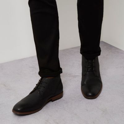 Black perforated chukka boots